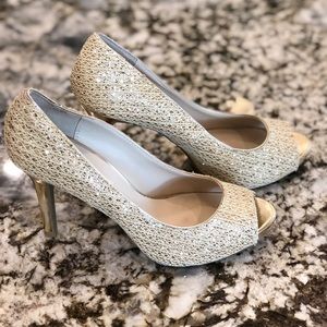 Audrey Brooke gold high heels